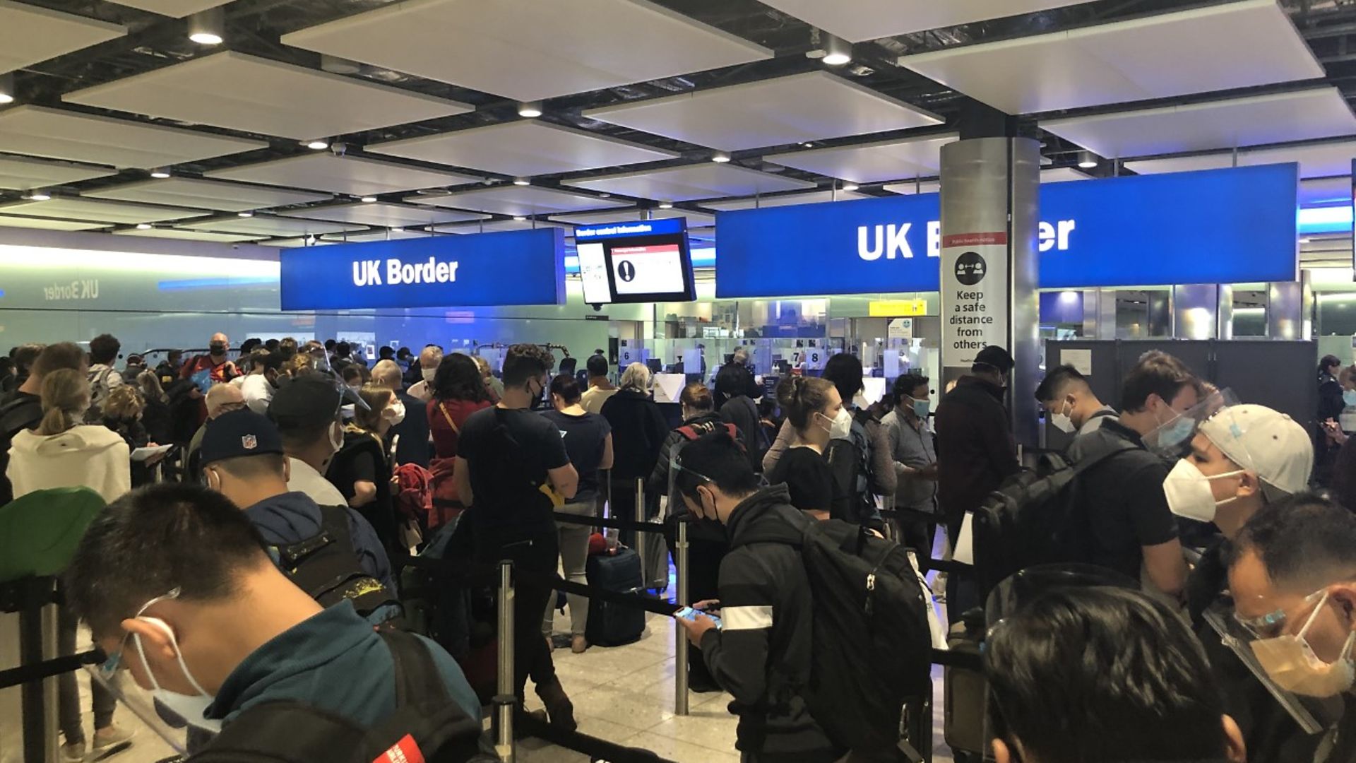 Dense crowds in the customs hall at Heathrow - Credit: Geoff McDonald