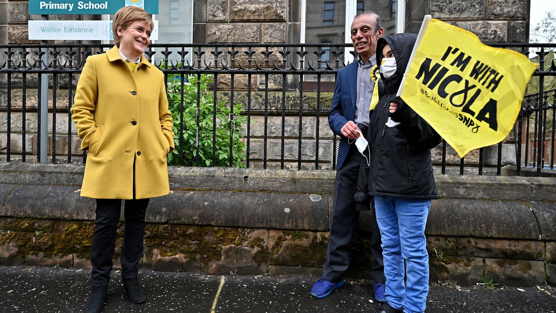 First Minister and leader of the SNP Nicola Sturgeon meets voters as she arrives to cast her vote in the Scottish Parliamentary election at the Annette Street school in Govanhill, Glasgow - Credit: PA