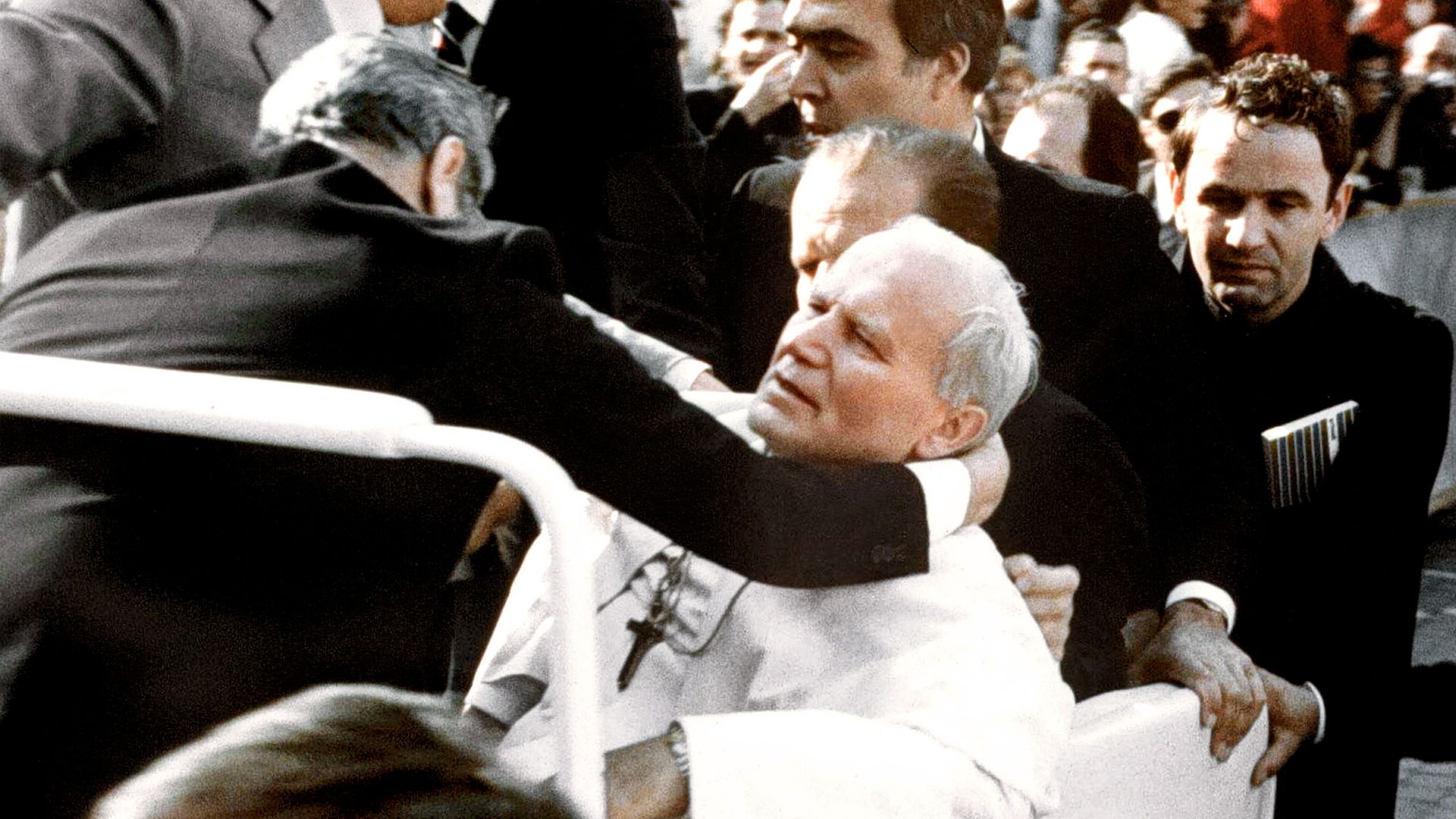 Bodyguards hold Pope John Paul II (C) after he was shot 13 May 1981 on Saint Peter's square by a Turkish extremist - Credit: AFP via Getty Images