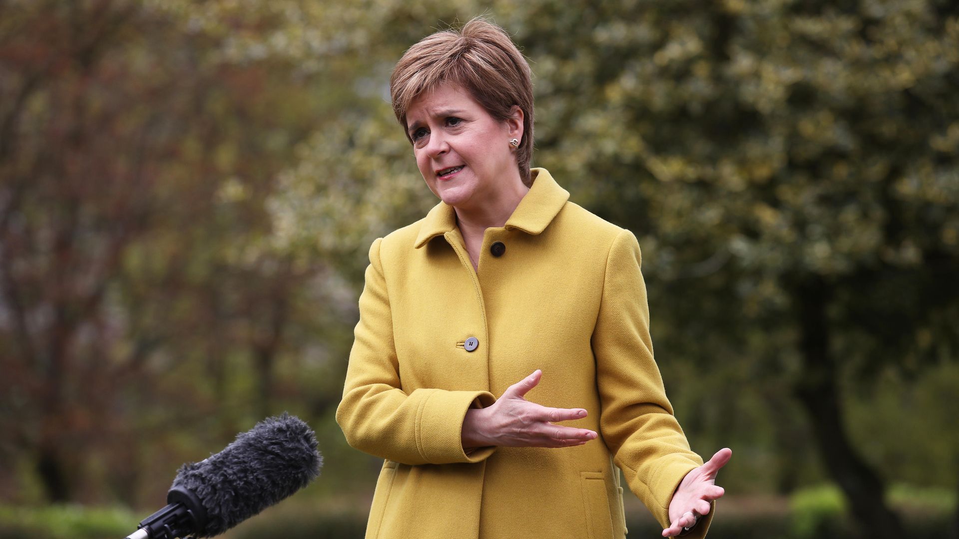 Scottish First Minister and SNP leader Nicola Sturgeon speaks to the media during a visit to Airdrie, North Lanarkshire - Credit: PA