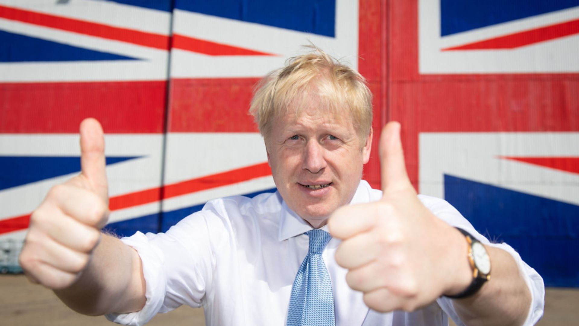 Boris Johnson poses for a photograph in front of a Union flag - Credit: Getty Images