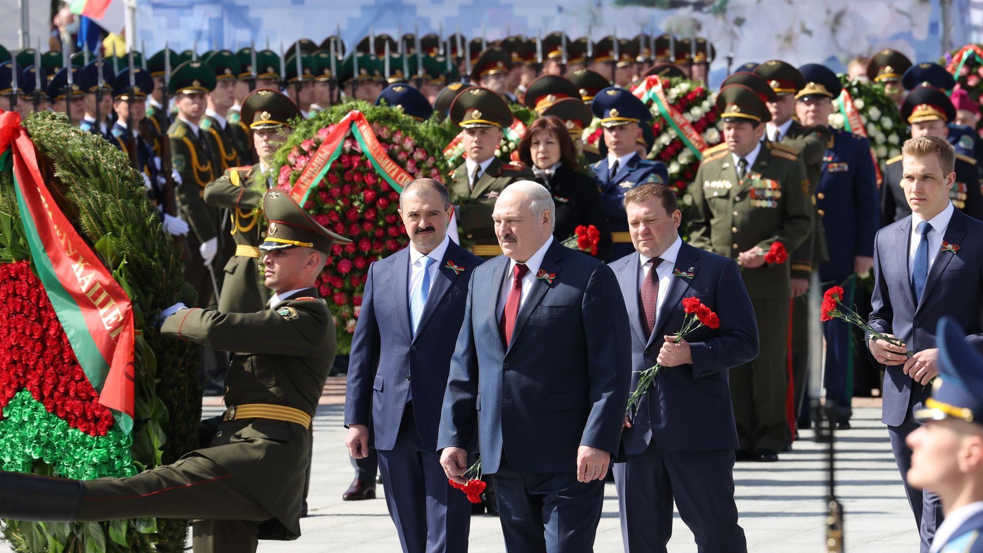 Belarus' president Alexander Lukashenko (C front), with his sons, presidential security aide Viktor Lukashenko, Belarusian National Olympic Committee member Dmitry Lukashenko, and his youngest son Nikolai Lukashenko (L-R), as they lay wreaths on Victory Day, 2021 - Credit: Maxim Guchek/BelTA/TASS