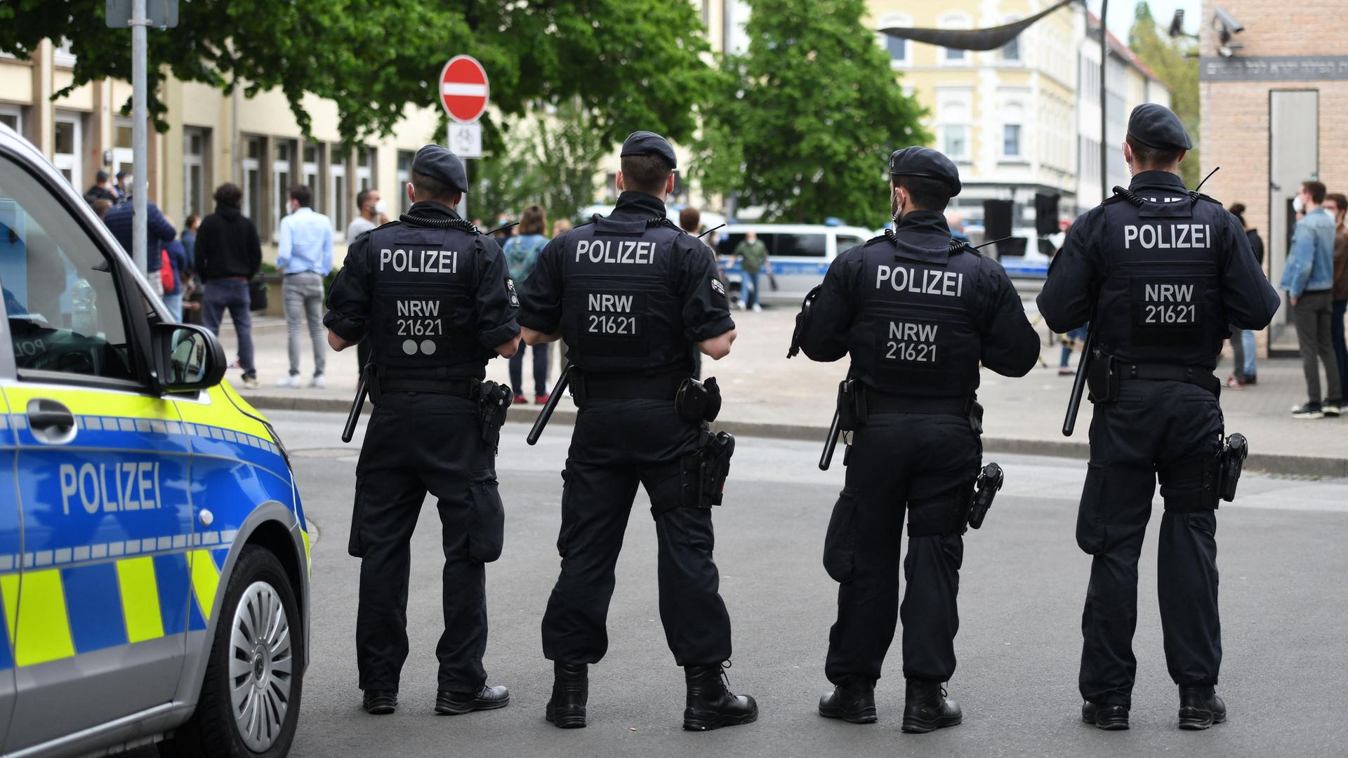 Policemen stand in front of a synagogue in Gelsenkirchen, Germany. Officials vowed "unwavering" protection of synagogues after scattered demonstrations over the conflict in the Middle East saw protesters shout anti-Israeli slogans and burn Israeli flags - Credit: AFP via Getty Images