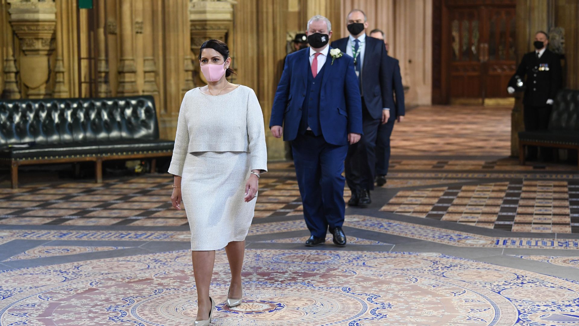 Priti Patel walks through the Central Lobby on the way to listen to the Queen's Speech - Credit: PA