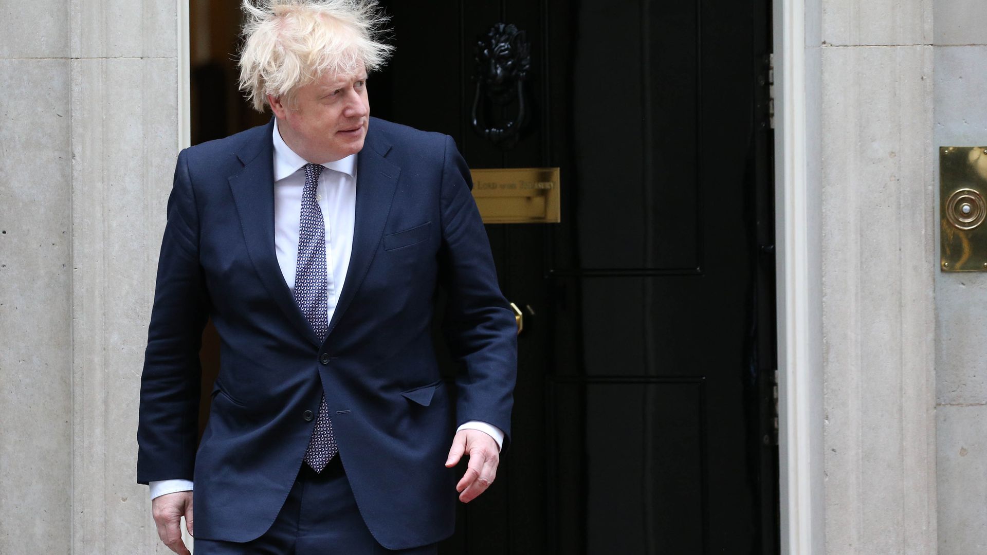 Prime Minister Boris Johnson outside 10 Downing Street in London - Credit: PA