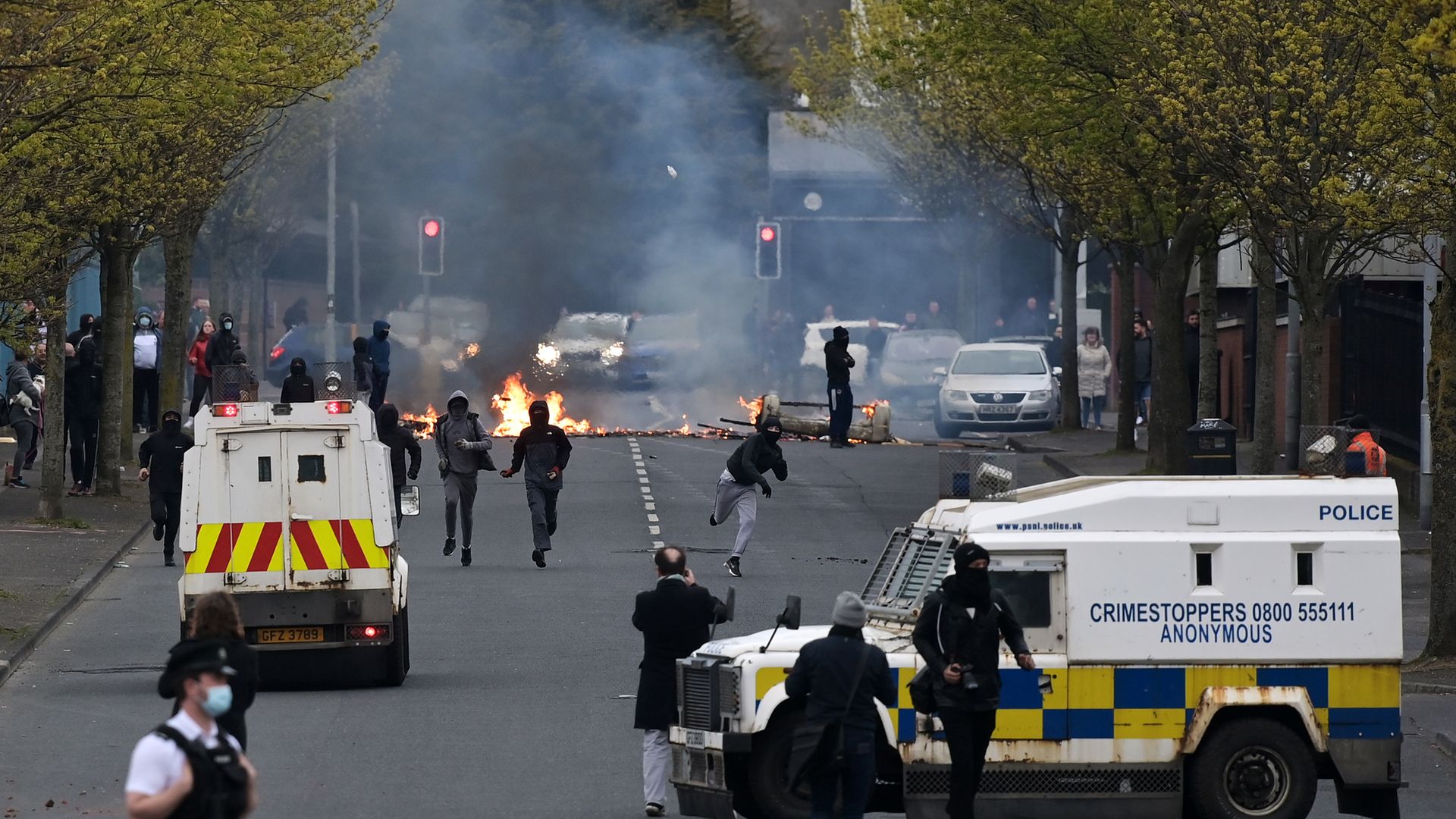 Loyalists light fires and throw projectiles at police in Belfast, amid tensions over the Protocol, in April 2021 - Credit: Getty Images