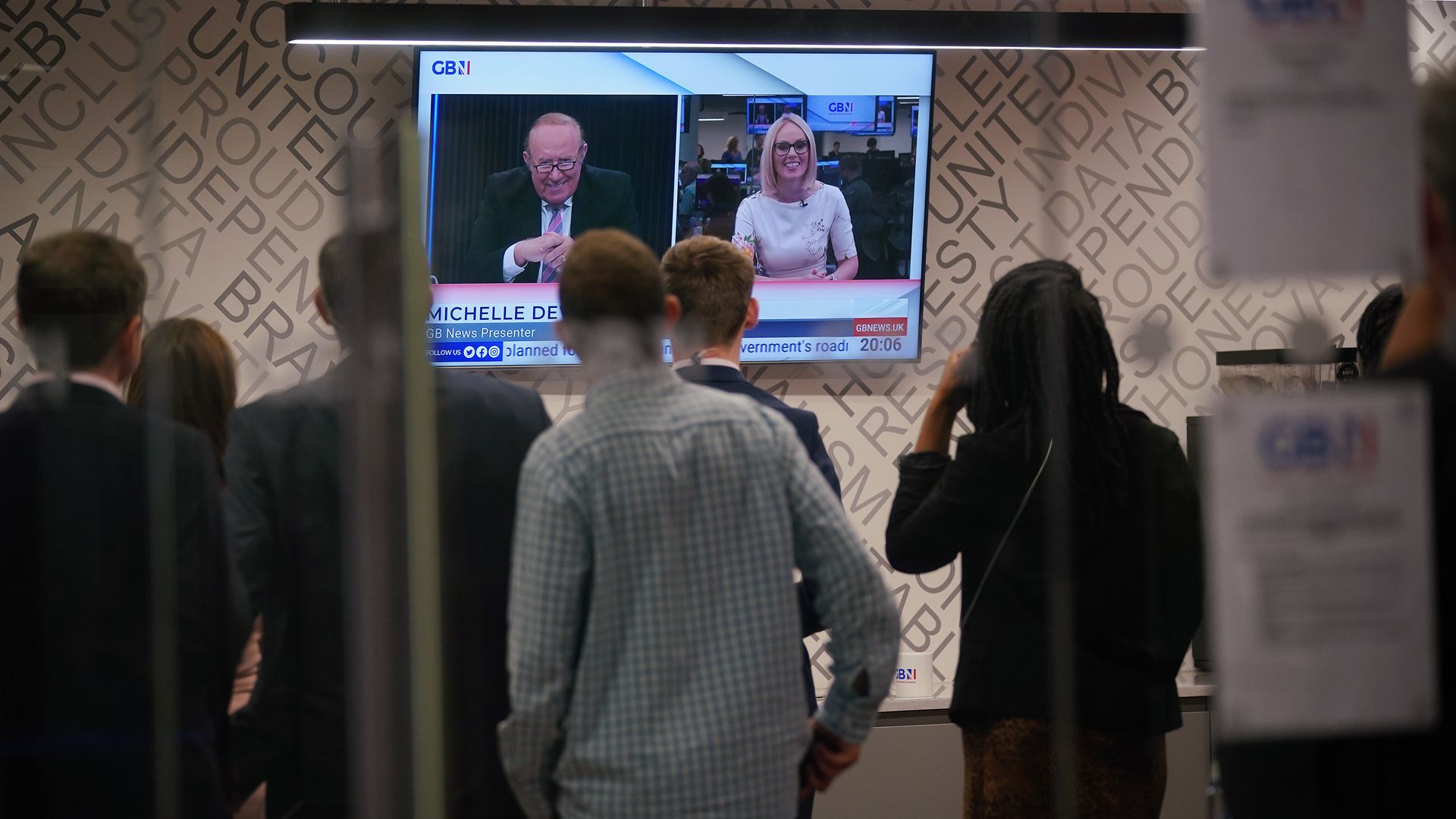 GB News staff watch Andrew Neil and Michelle Dewberry broadcast during the launch of TV channel GB News, Sunday June 13, 2021 - Credit: PA Wire/PA Images