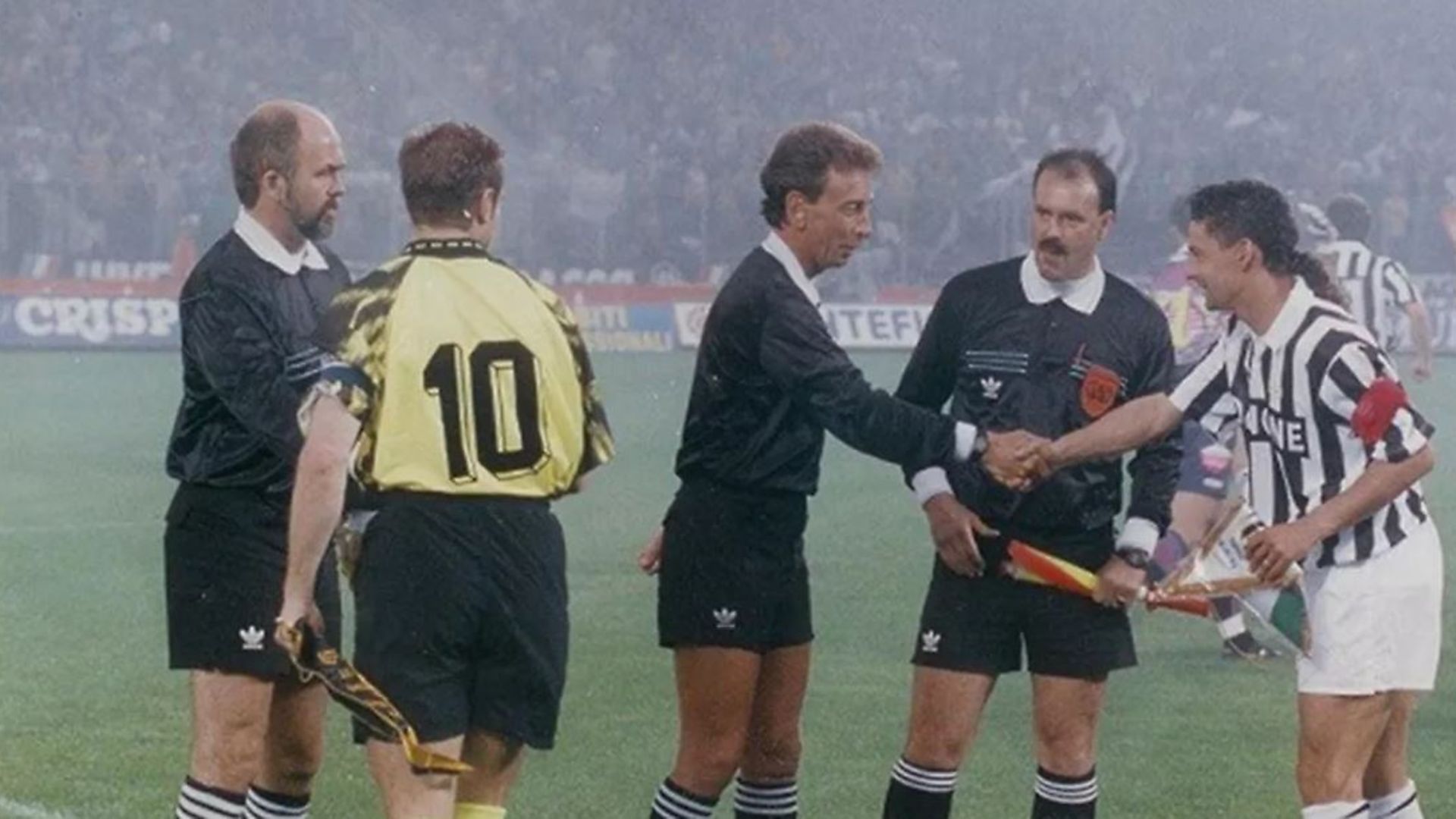 John Blankenstein shakes hands with Roberto Baggio at the start of the 1993 Uefa Cup final between Juventus and Borussia Dortmund - Credit: John Blankenstein Foundation