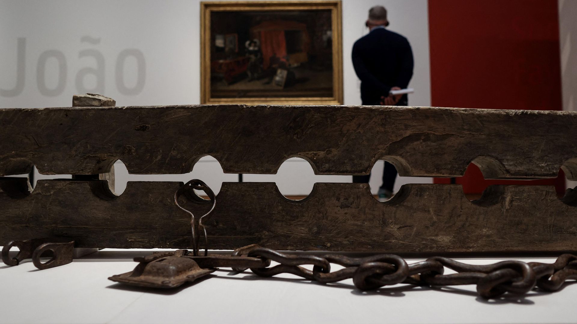 Multiple foot stocks for constraining ensclaved people, as seen in the slavery exhibition at Amsterdam's Rijksmuseum - Credit: Photo by KENZO TRIBOUILLARD/AFP via Getty Images