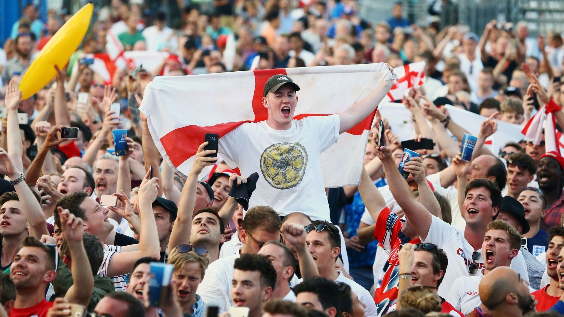 England fans sing the national anthem in the fan zone in Nice, France during Euro 2016 - Credit: PA