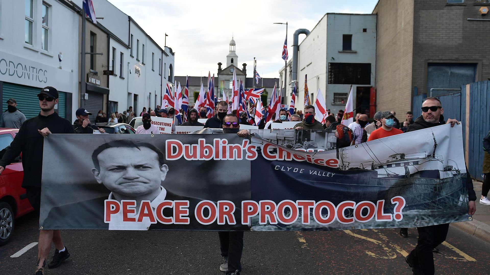 Loyalist band members and supporters make their way through Newtownards town centre following an anti-Northern Ireland Protocol protest rally in June 2021 - Credit: Getty Images