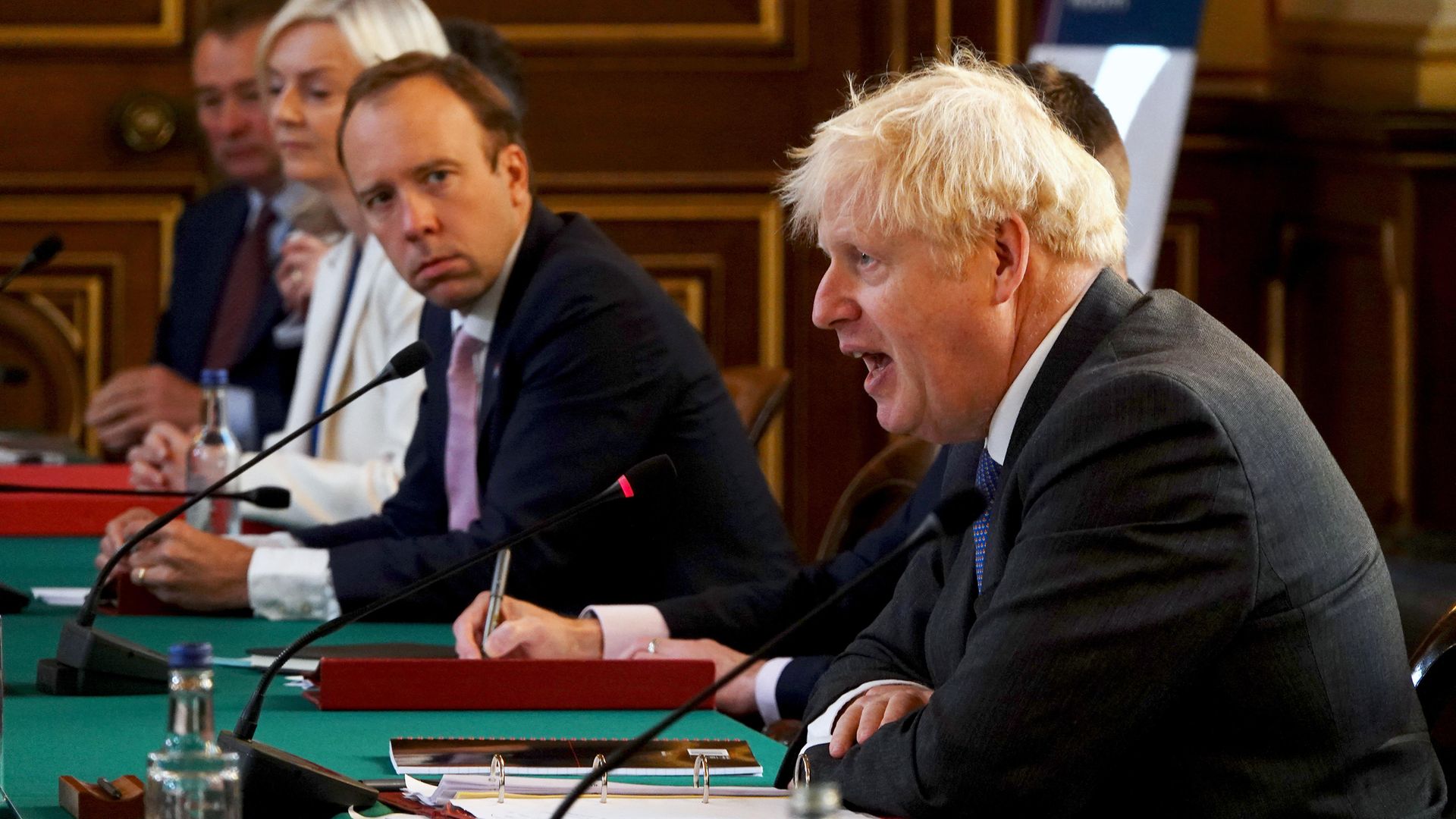 Matt Hancock as he listens to Prime Minister Boris Johnson (right) during a cabinet meeting - Credit: PA