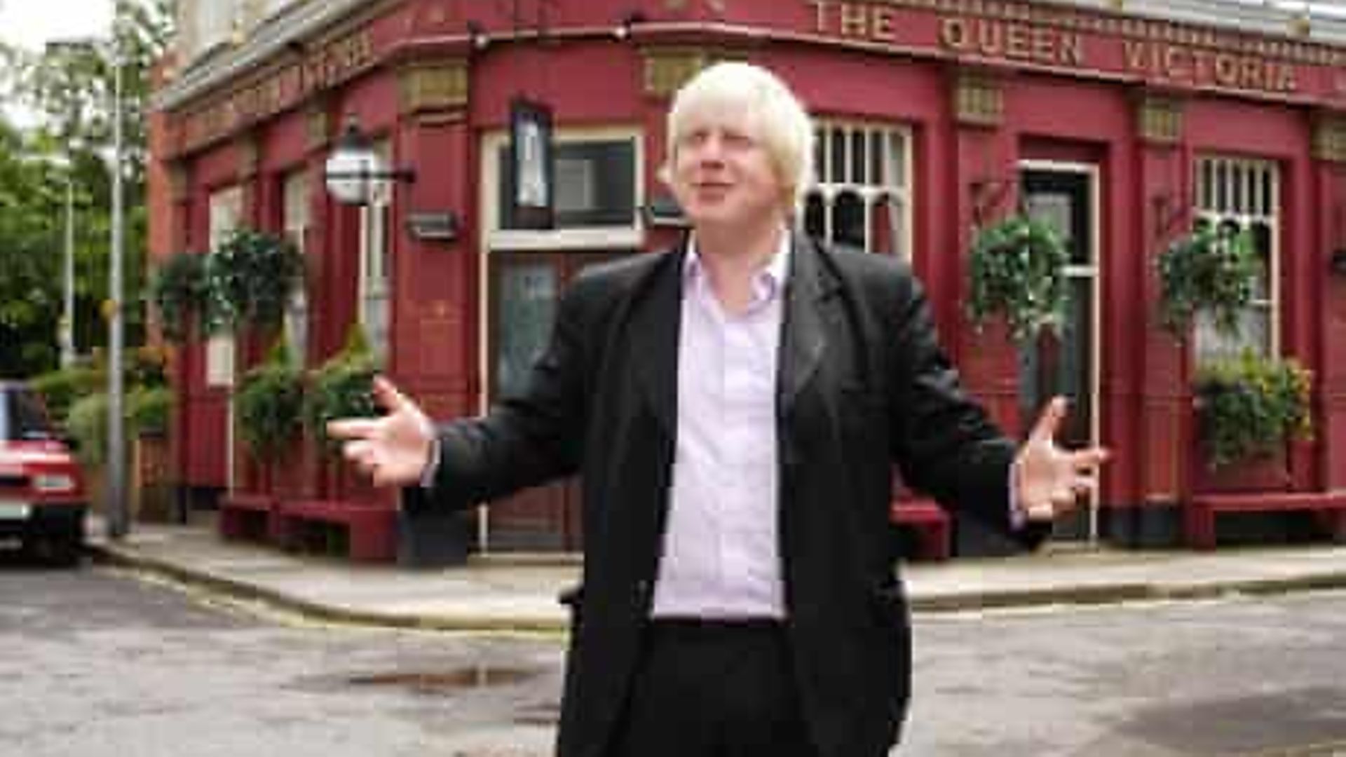 Boris Johnson in front of the Queen Vic in Albert Square in 2009, when he made a cameo appearance on EastEnders - Credit: BBC