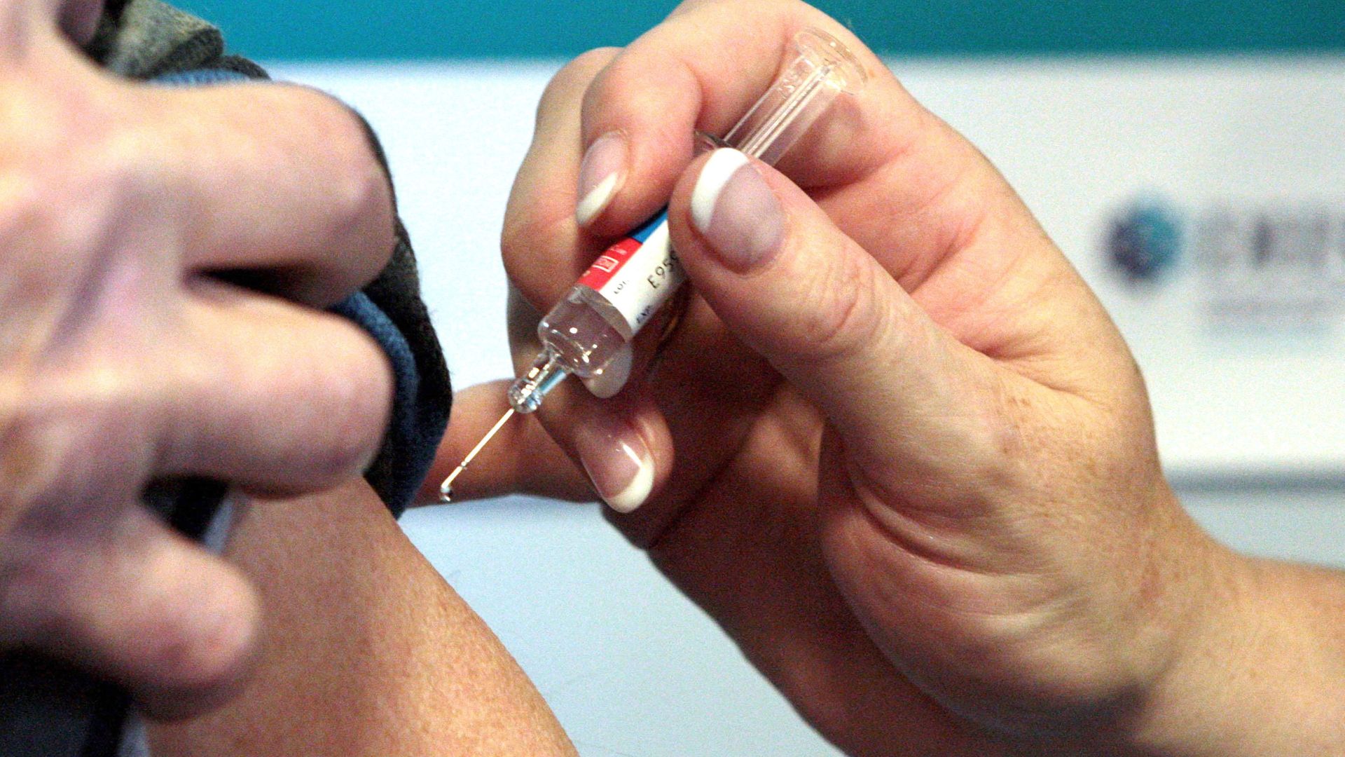 A person receiving a vaccination - Credit: PA