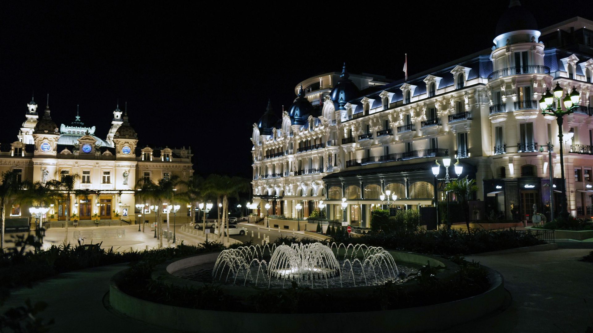 Monte Carlo's Place du Casino at night - Credit: Photo by Valery Hache/AFP via Getty Images