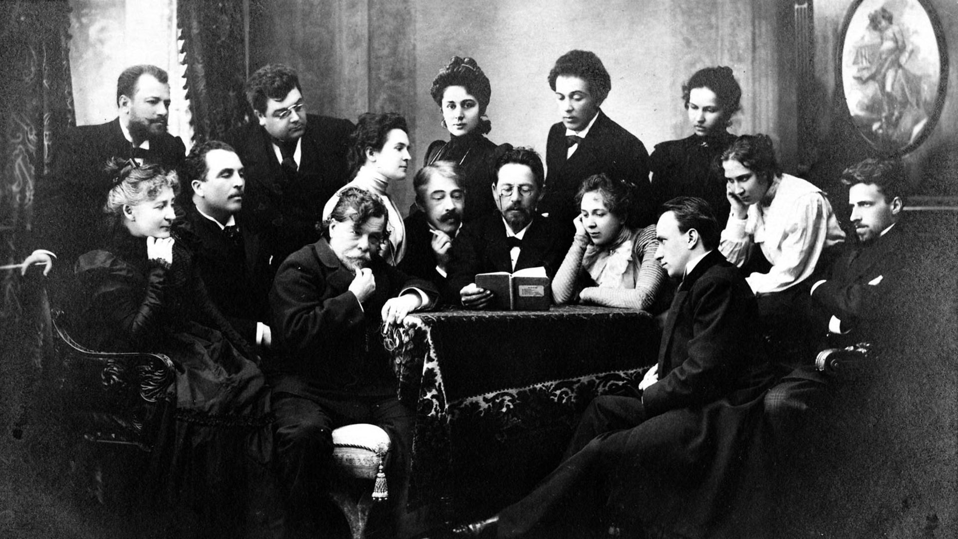 Anton Chekhov, in the centre, reads a script to actors from the Moscow State Art Theatre in 1898 - Credit: Getty Images