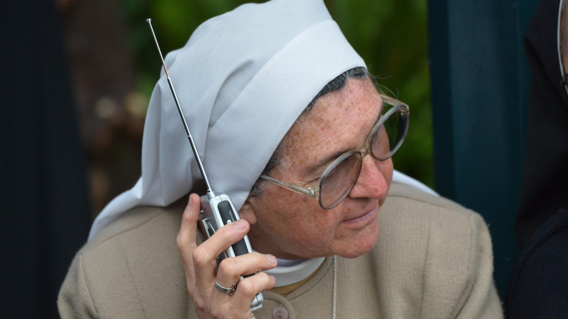 A nun listens to the radio in Ecuador, ahead of a 2015 visit by Pope Francis - Credit: Photo: Martin Bernett/AFP via Getty Images