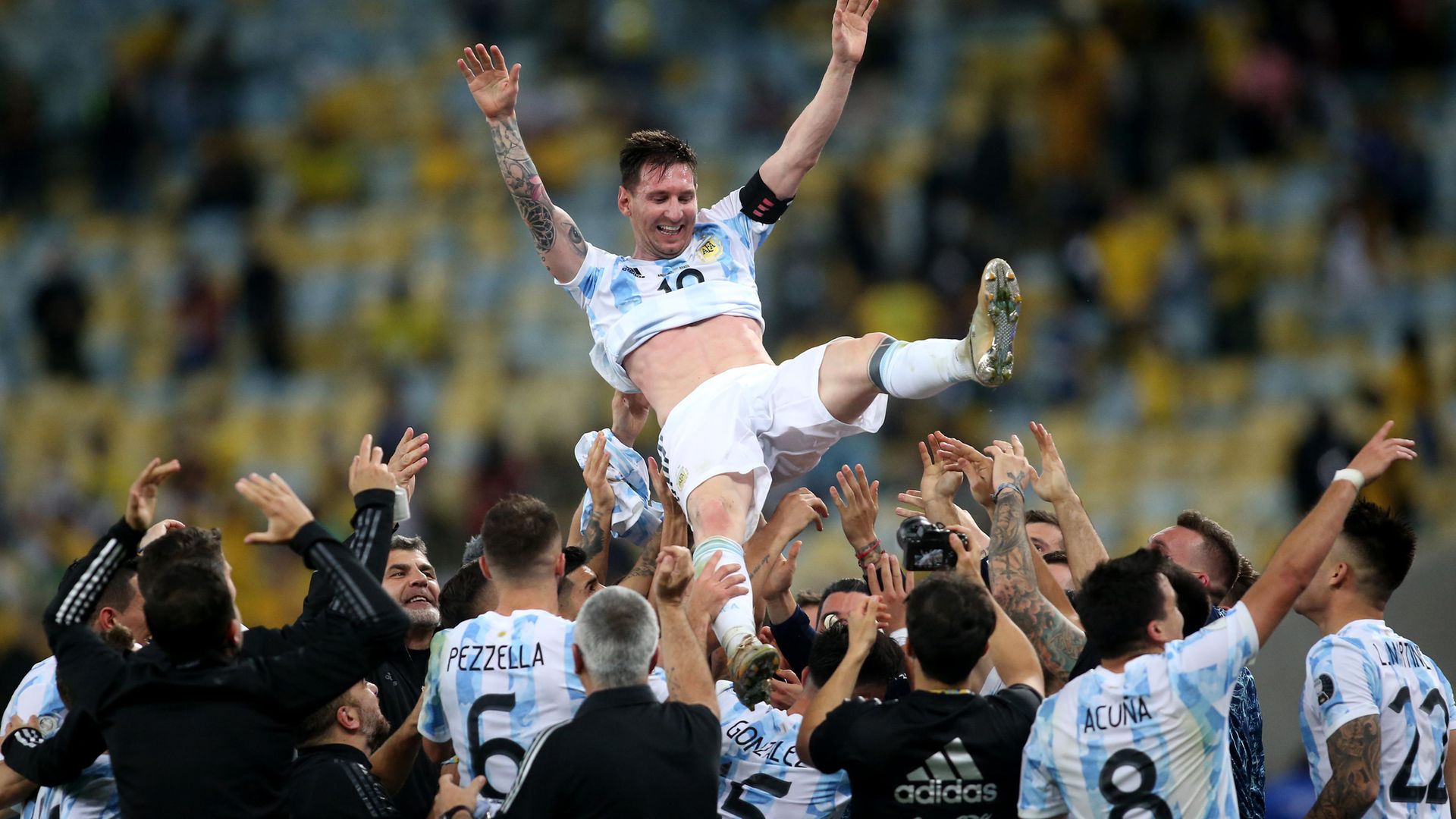 Argentina players throw Lionel Messi in the air after beating Brazil in the Copa America final - Credit: Photo by MB Media/Getty Images