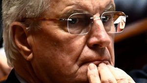 Michel Barnier ponders during a session of questions to the government at the National Assembly in Paris (Photo by JULIEN DE ROSA/AFP via Getty Images)